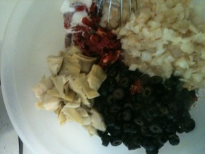 Clockwise: Sundried tomatoes, sauteed onions, olives, artichoke hearts...