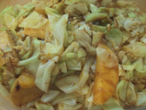 Cabbage, cinnamon, stevia, apple, orange, and coconut oil. Yum!